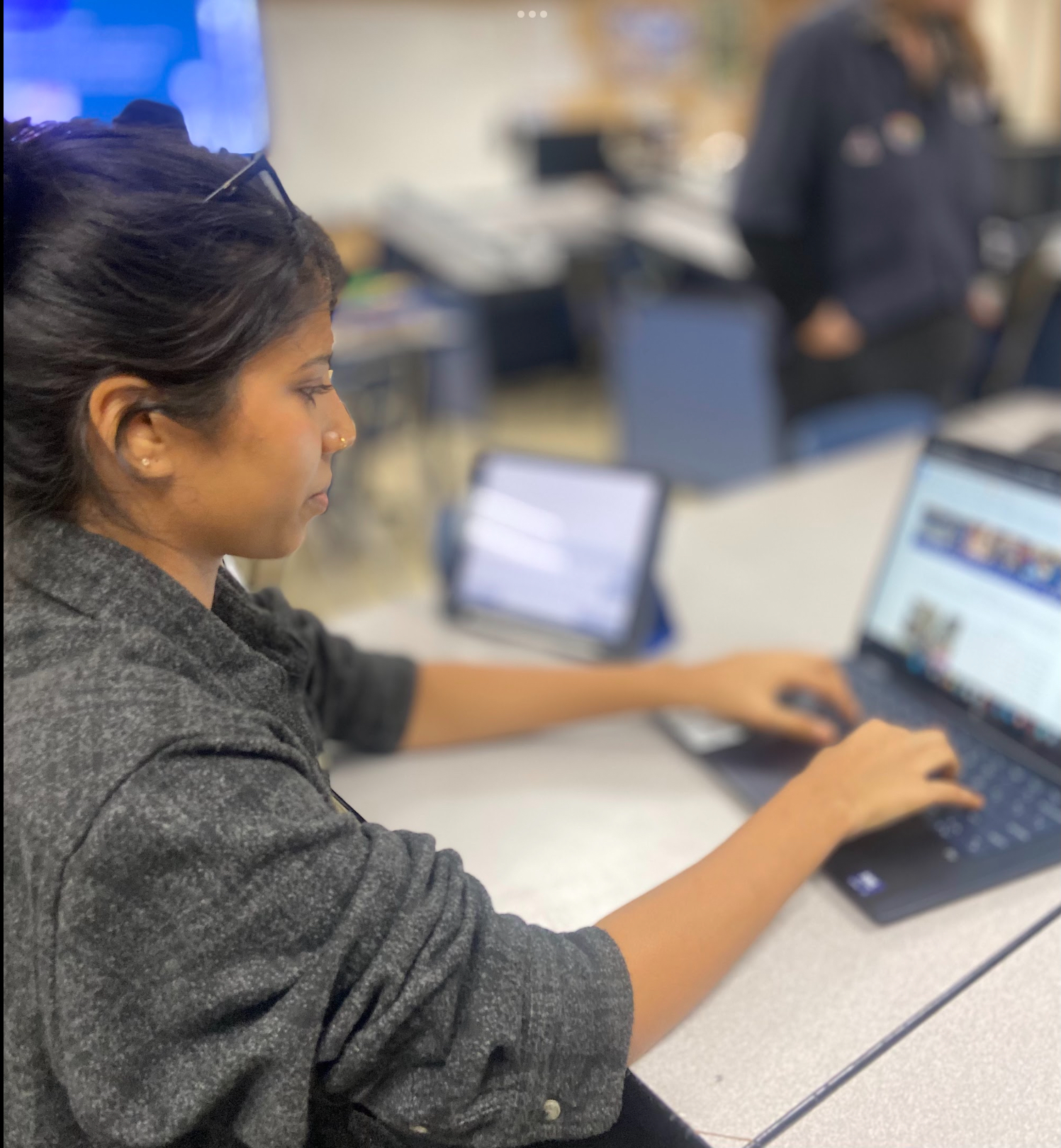 A member of the operations team working on the weekly newsletter.